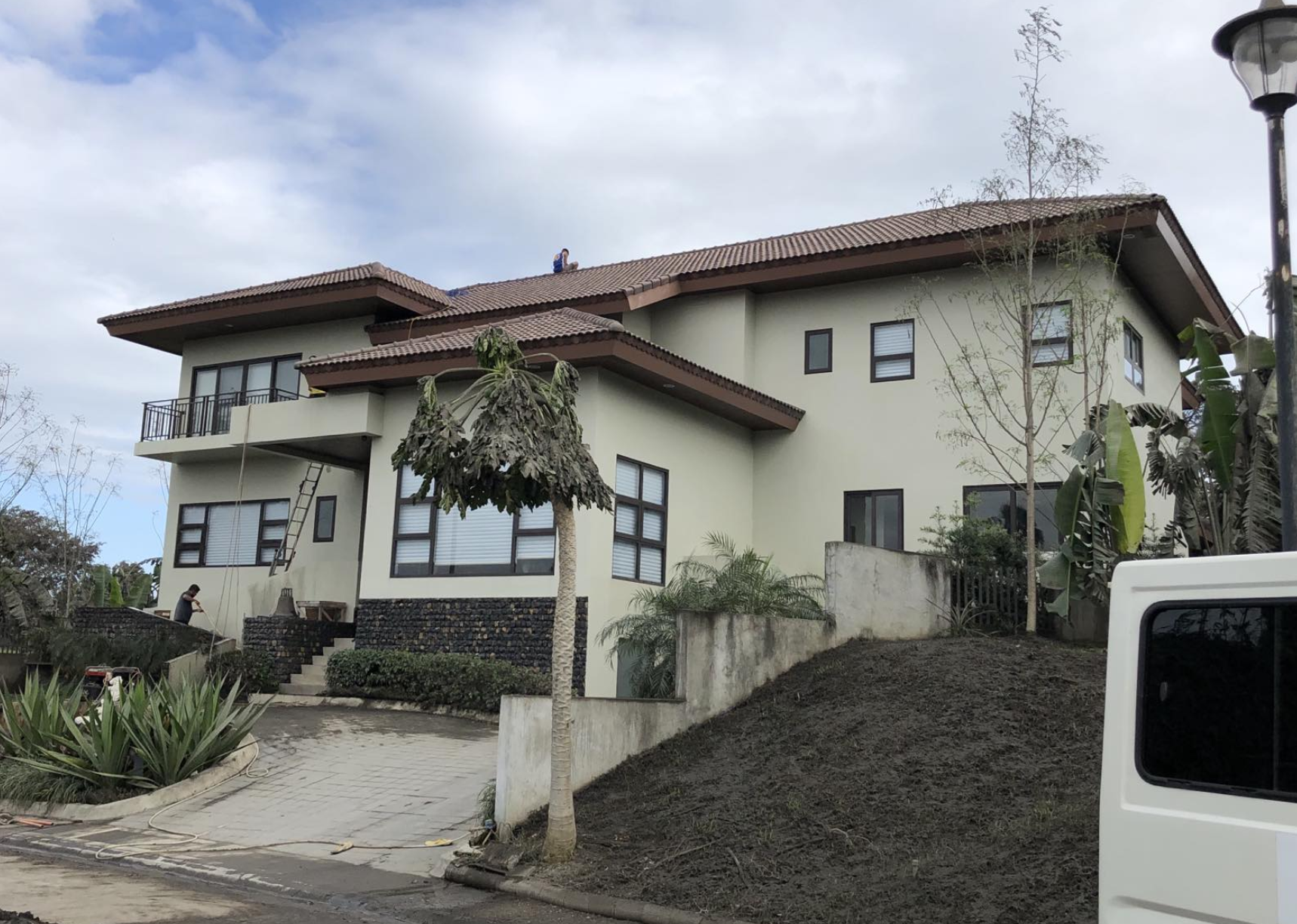 Two-story residential house with aluminum window installation